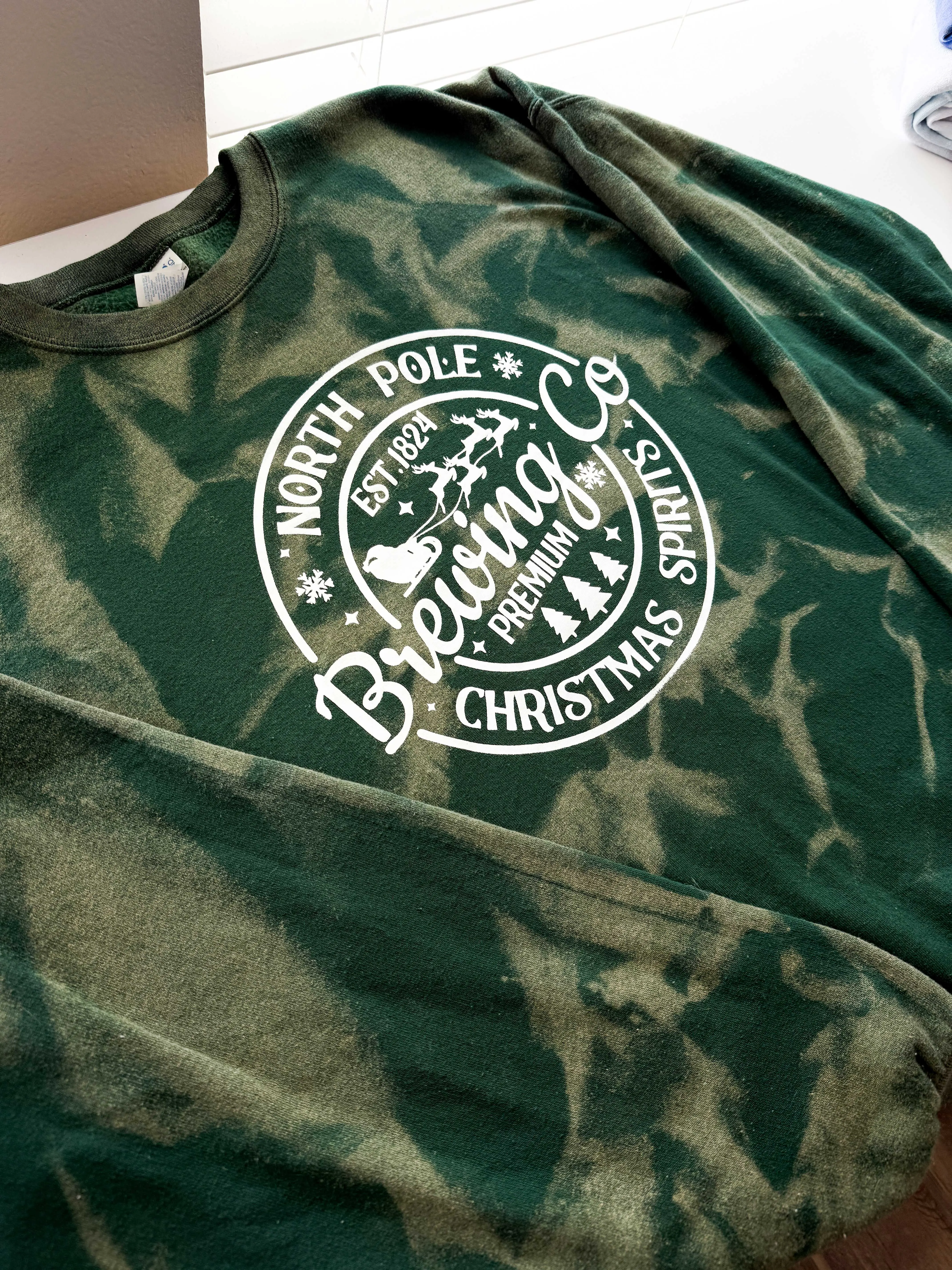 North Pole Brewing Co. Christmas Spirit Green Reverse Dye Sweatshirt