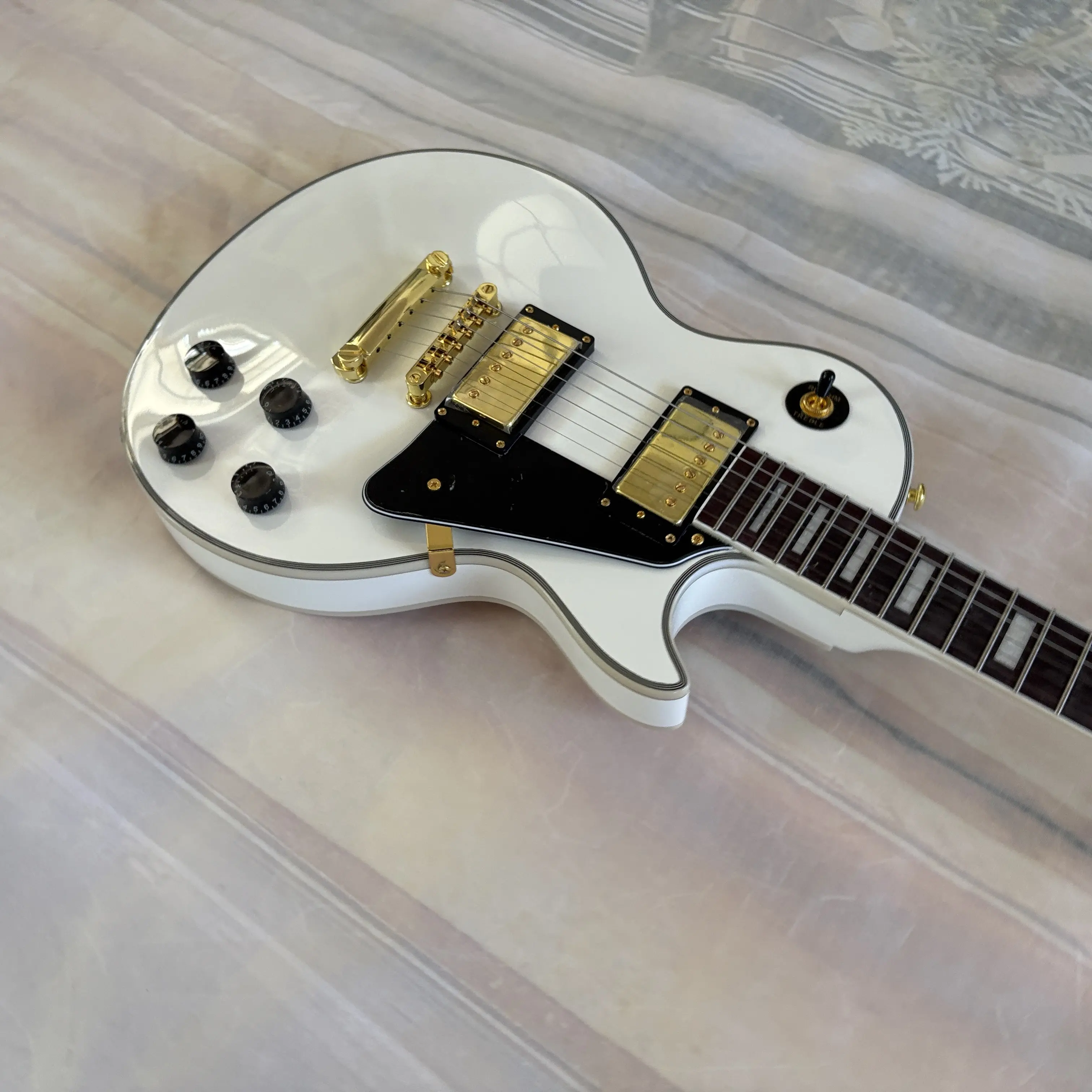 White 6-string LP electric guitar with mahogany body, chrome hardware, rosewood fretboard, 22 frets
