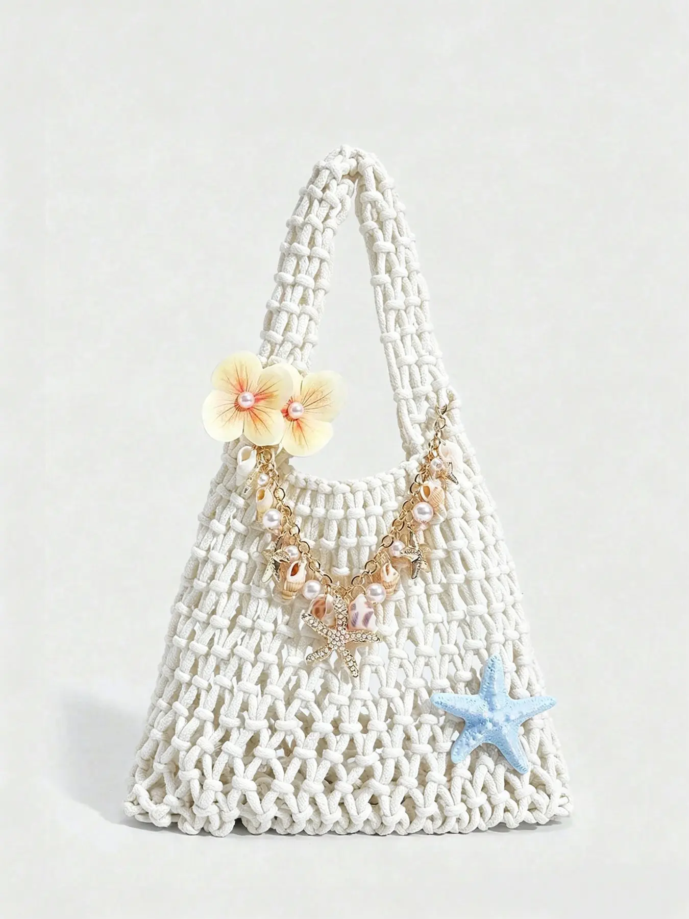 Elegant and gentle atmosphere, ocean element chain decoration handbag with flower decoration design, retro fashionable and exquisite practical texture bag, suitable for beach vacation, shopping mall, party