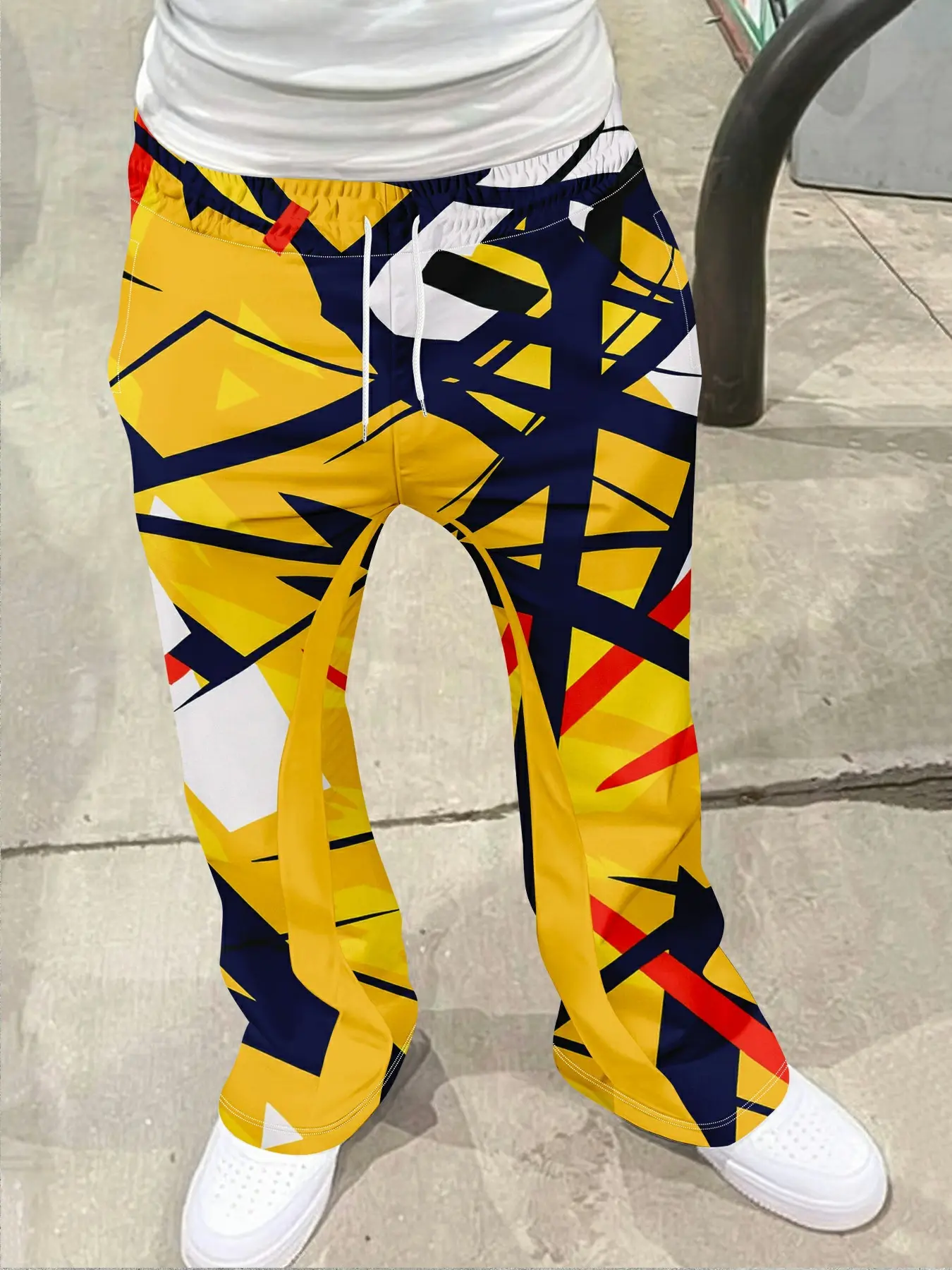 Men's streetwear retro flared pants, Casual streetwear trousers, Casual Fashion Bottoms, contrasting colors with geometric lines and irregular graphic splicing, drawstring waistband, white stripes on the sides, tassel decoration on the hem