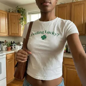 [Sale Up To 50%] Feeling Lucky St Patricks Day Crop Top Shirt, Y2K Graphic Tee, Irish Clover Lucky Charm T Shirt for Women Casual Gift Idea