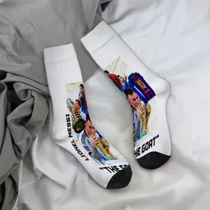 Mid-calf socks, featuring Messi kissing the World Cup trophy in a regal design, celebrity merchandise, durable socks, unisex socks, perfect for fans, holiday gifts, and birthday presents.