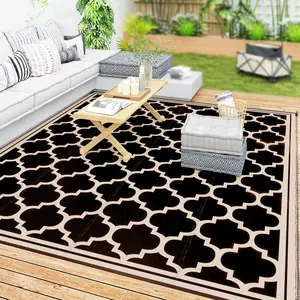 9' x 12' Reversible Outdoor RV Rug – Black & Beige. Double-Sided – Flip for Fresh Style. Waterproof Plastic Straw. Easy Clean – Rinse, Sweep, Wipe. 4 Corner Loop Straps. Perfect for Camping, Deck or Beach