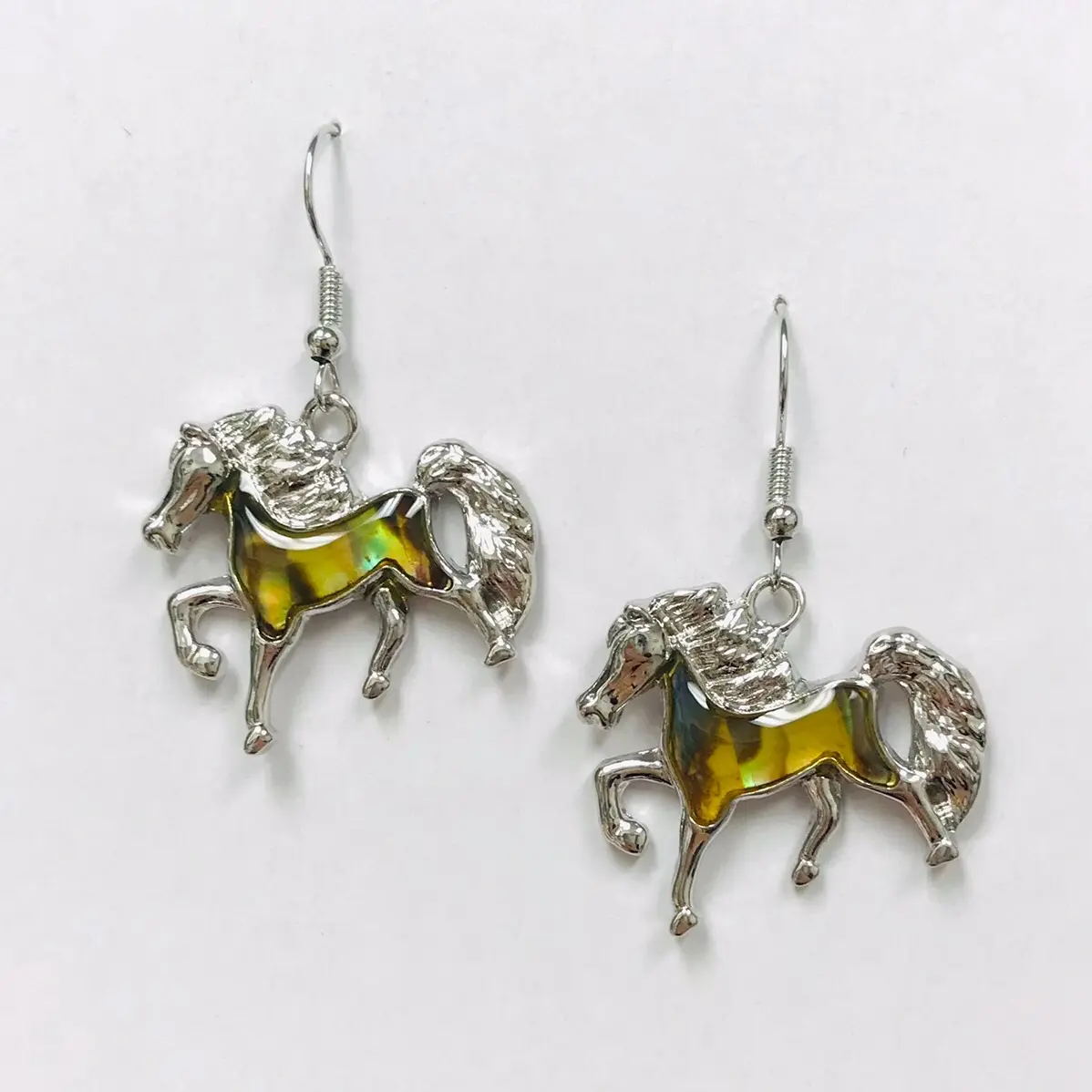 Paua shell horse earrings
