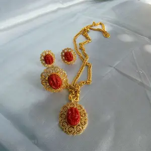 Red Ganesh muga pendant in gold tone chain with matching Earrings and adjustable finger rings for women