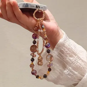 Luxurious and sophisticated mobile phone wrist strap with pink butterfly pendant, short style, niche and exquisite crystal chain, universal