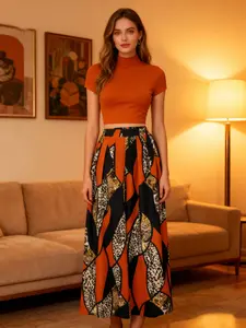A women's set, Fashion style sets, featuring an orange fitted short turtleneck top paired with a color-blocked leopard geometric print wide-leg long skirt, the style is retro and unique, suitable for dinner parties, art exhibitions, dates, and more