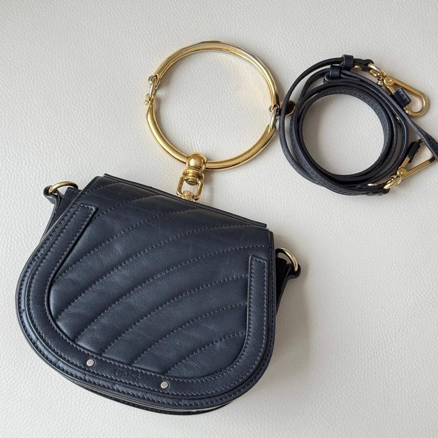Pre-owned Chloé Nile Small Bracelet Saddle Bag Black Calfskin, Striped Suede, Gold Tone Ring Handle Crossbody Bag (2605322)