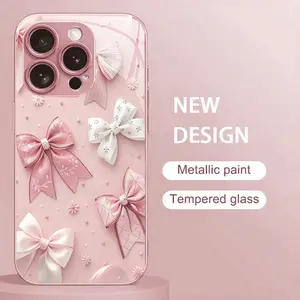 Phone Case: Made of tempered glass with a bright pink bow pattern, suitable for iPhone 17, 16, 15, and 14 series models. Pink metallic texture design targets fashionable young women, combining trendy style with high cost performance