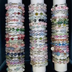 10Pcs of Stylish and Elegant Women's Glass Bead Bracelet Set, Featuring Sparkling Cracked Beads Paired with Floral, Butterfly, Fishtail, Star, and Bowknot Pendants. Niche and  Design - Colors and Styles Shipped Randomly. A Stackable Bracelet Set