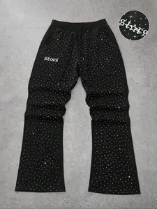 Bling Flare Pants | Y2K Vibes, Fitted, Streetwear Sparkle, These black elastic-waist flares are drenched in shimmering studs with iconic star logo detail — perfect for OOTD flexes, club fits, or 2000s-inspired looks. Comfy, eye-catching, and ma