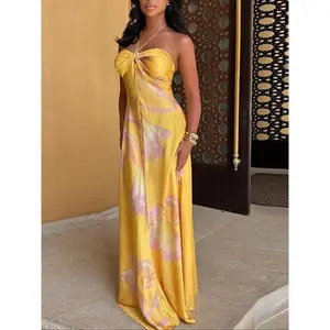Women’s strapless, lace-up, knotless front, printed long skirt; sleeveless, backless, slim fit; elegant yet sexy; lightweight satin flowy dress; available in blue and pink color-block options; bohemian tropical vacation beach party style; GARMENTARY