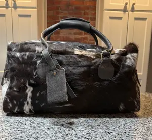 XL genuine cowhide duffel travel bag with matching luggage tag