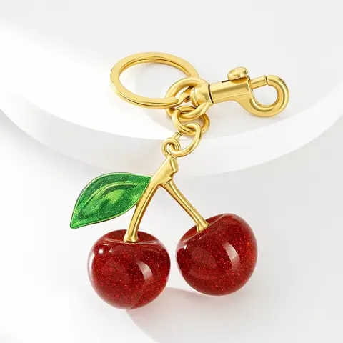 Ampere Creations Cherry Bag Charm - Glossy Red Cherries, Sparkling Green Leaves, Luxe Gold-Tone Hardware, Clip-On Lobster Clasp, Fashion Bag Charms for Handbags, Purse Accessories with Clip-On Convenience for Gifting, Collecting