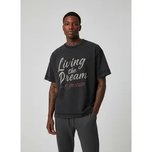 Vintage Black Stitch Tee — “Living the Dream” (F. Krueger)