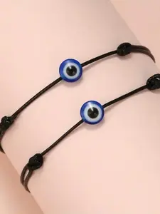 Handmade retro colored string bracelet set featuring evil eye charms, perfect for couples and friends to wear.