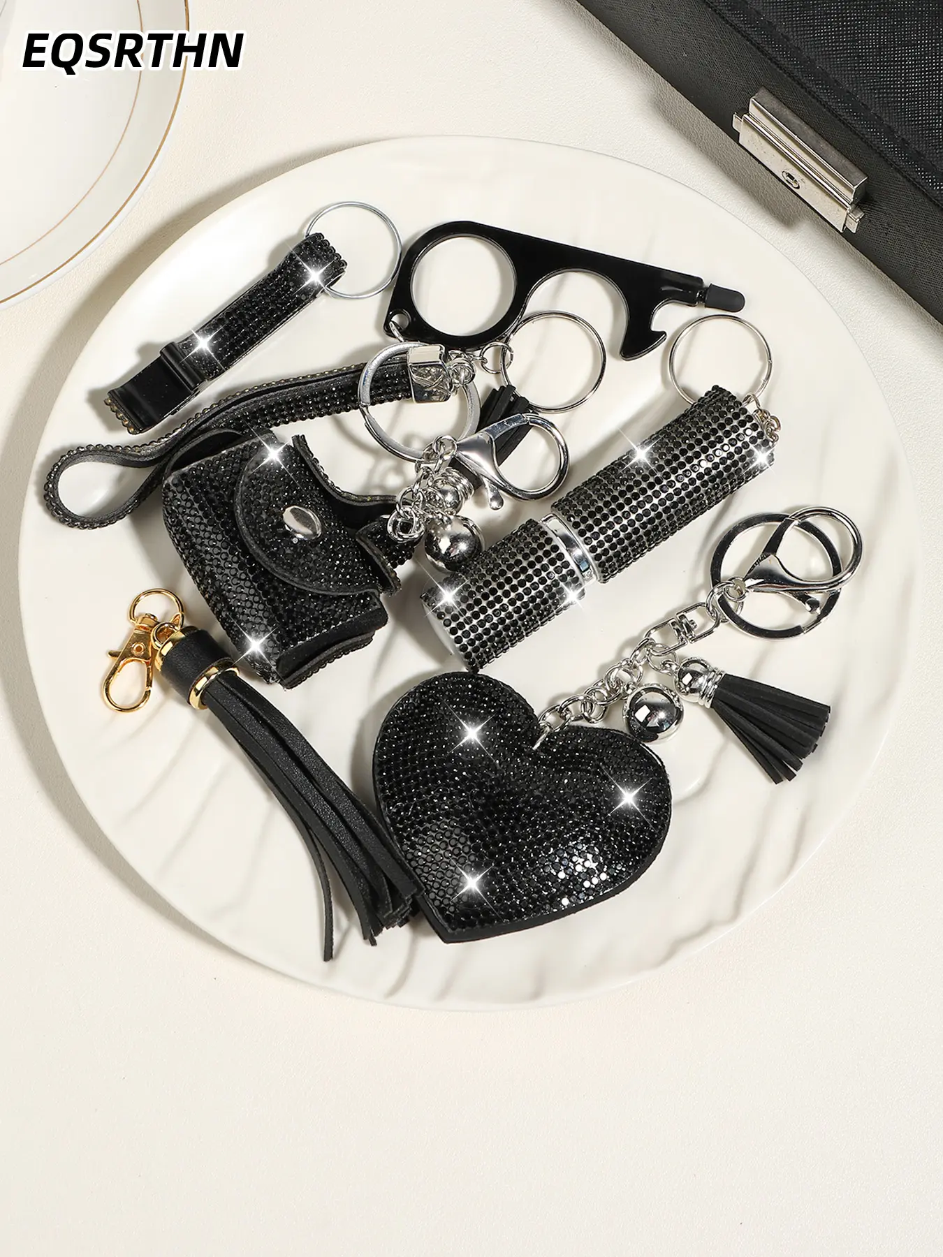 Black and silver full diamond keychain set with an edgy and high-end vibe, Stylish Keyring, Bling Bling Keychains. Complete with a heart pendant, bottle opener and lipstick case, it's a must-have accessory for every sweet and cool girl's bag.