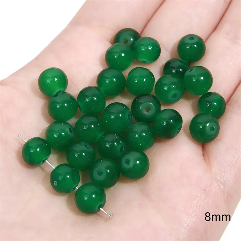 Green transparent solid color glass beads, crystal beads, round beads, bamboo beads, used for DIY handmade bracelets, necklaces, and jewelry Green transparent solid color glass beads, crystal beads, round beads, bamboo beads, used for DIY handmade bracelets, necklaces, and jewelry