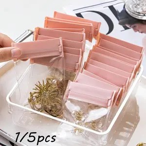 This stylish transparent jewelry organizer bag, Collapsible stackable storage, features a resealable zipper and is perfect for travel jewelry storage. Ideal for rings, earrings. A travel essential, perfect for dorm stays, trips, or beach vacations