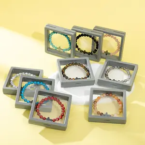 TTZZ Unisex Cross Beaded Bracelet. 8MM, couples' favorite. Made of natural lava rock, turquoise & tiger's eye. Stretchy, anxiety - relieving. Stylish, comfy, stress - busting, gift - ready, great for meditation & yoga.