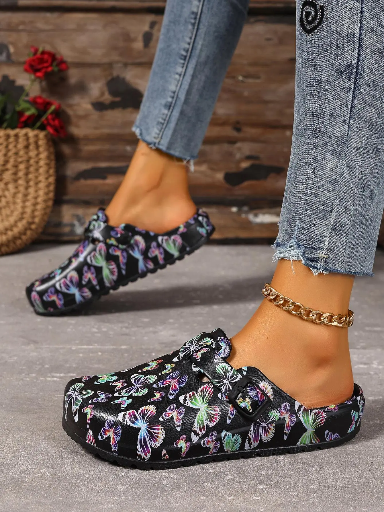 Women’s fashion mule shoes featuring a colorful butterfly print design—made from soft, durable EVA material with an adjustable buckle; closed-toe for all seasons, comfortable to wear, suitable for everyday wear, outdoor activities, light travel, gardening