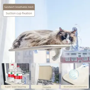 Cat hammock on window sill, enjoying the sun. Hanging bed with suction cups. Suction cup-style all-season balcony glass cat bedding