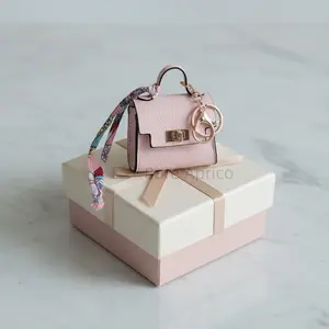 1PCS mini Kelly bag charm, crafted from high-quality and durable PVC material. Compact and stylish, it can hold earphones, lipstick, and serves as a fashionable accessory.