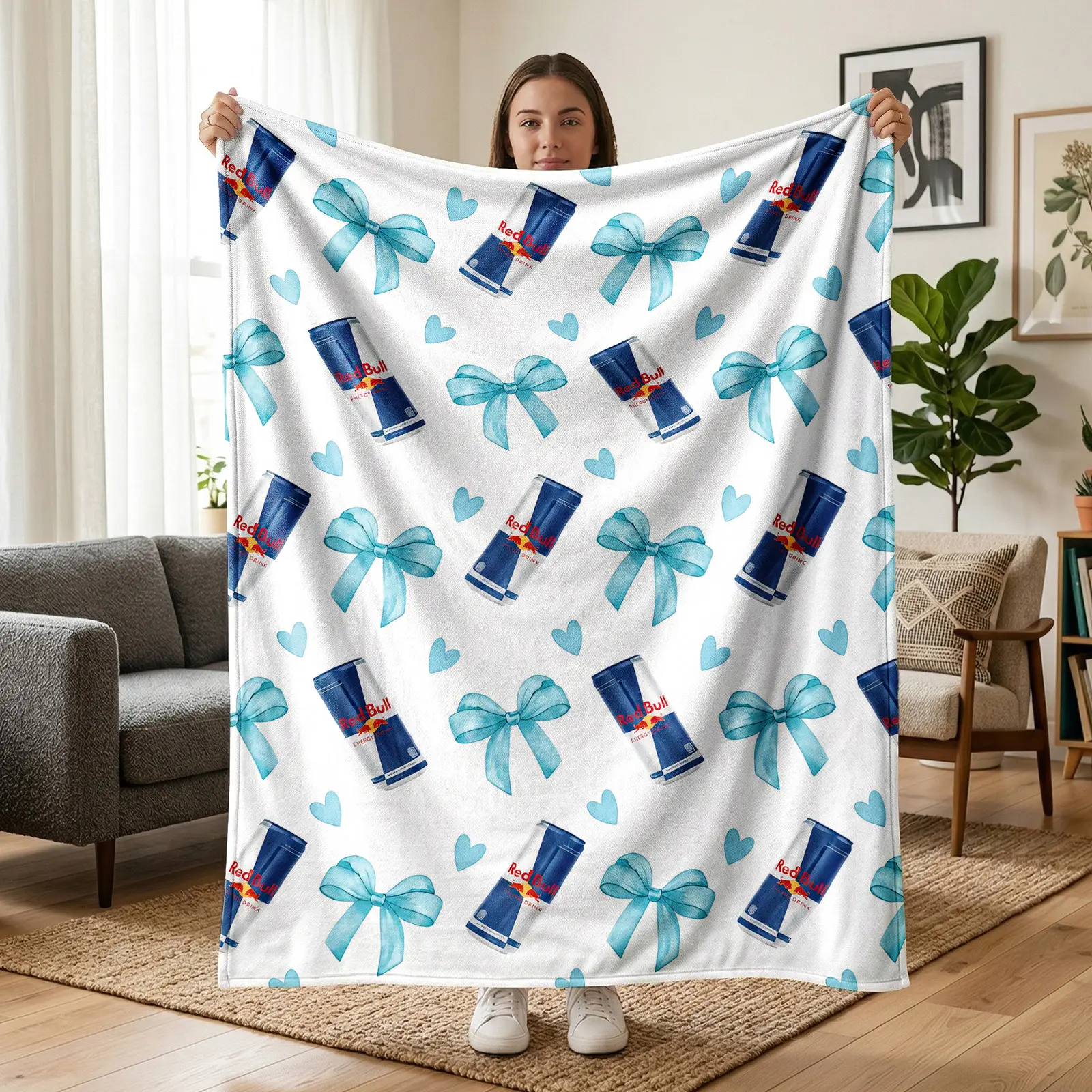 1 pc Red Bull soda flannel blanket with allover floral print, featuring a Red Bull beverage can graphic, light blue bows, and an allover pattern of hearts; fresh, sweet, cool American casual style. Soft, warm nap blanket—suitable for sofa, bed, office, sh