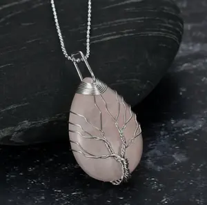 Celtic Tree of Life pendant with chain on a teardrop-shaped semi-precious stone.
