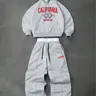 Men's two-piece tracksuit: a hooded sweatshirt and drawstring trousers with lettering and small graphic designs, perfect for fall and winter, Hoodie sweatpants set