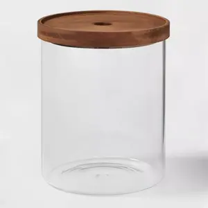 105oz Glass Storage Canister with Wood Lid Glass canister with wood lid helps preserve the contents Clear glass helps you see through the contents