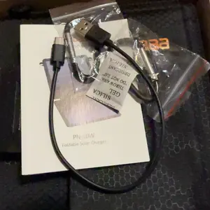 10W Solar Charger, IP65 Waterproof, Foldable with Dual USB Outputs (5V/2A Max) for iPhone, iPad, Samsung, and more. Ideal for outdoor use.