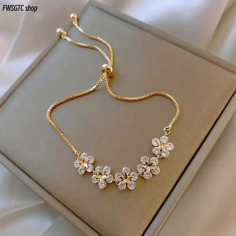 Single adjustable stainless steel bracelet with delicate flower pendant. Minimalist elegant design, sturdy and durable. Versatile accessory suitable for daily casual look, party, dating and street style, also a nice thoughtful gift choice.