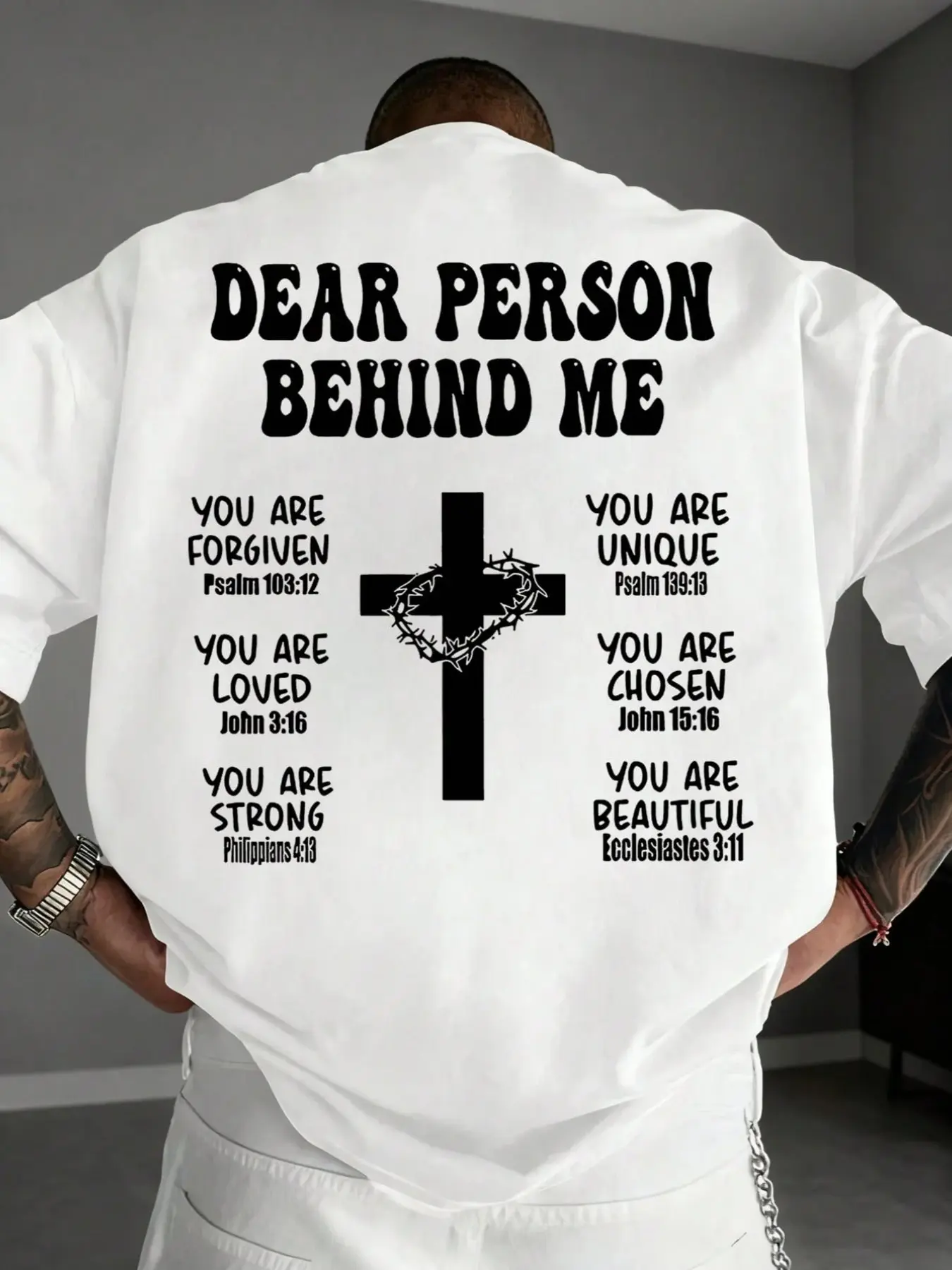 Men's Christian street-style oversized T-shirt, inspirational Bible verse print top with the phrase "To You Who Walk Behind Me" on the back, decorated with cross and crown of thorns patterns. It is a breathable loose crew neck casual top, perfect for chur