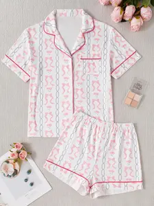 Ladies' two-piece pajamas set, featuring a chain-embellished and bow-print front-buttoned turtleneck shirt paired with elastic waist shorts, offering casual comfort. This short-sleeved top and shorts matching pajamas set is perfect for spring and autumn