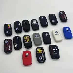 Silicone key covers for Volkswagen, SEAT, and Porsche vehicles, designed to protect against bumps and scratches. • Styles include themed designs such as GTI, special German editions, and animated characters, with prices varying based on material and desig