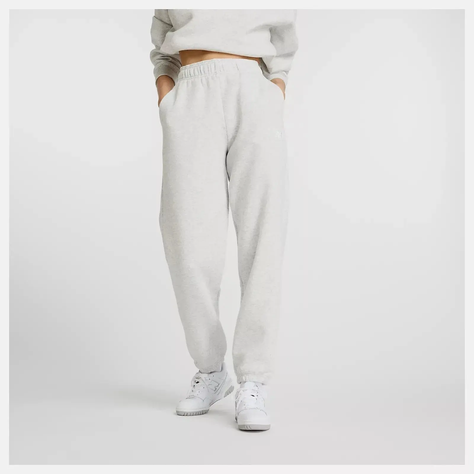 New Balance Sport Essentials Joggers Tapered Leg Pants in Gray Fleece | Women's