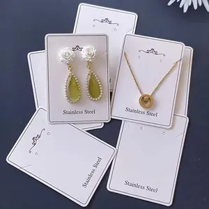 Product display set (100 pieces): necklace and earring display cards, protective bags, store accessories, high-quality white cards; complete set for wholesale.