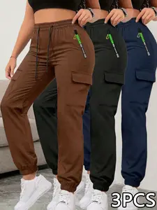 Women’s cargo jogger pants with zippered pockets for spring/summer, available in 1-pack or 3-pack. Featuring a fashionable large pocket design and an elastic waistband with an elastic drawstring waist, these are slim-fit long pants suitable for casual out