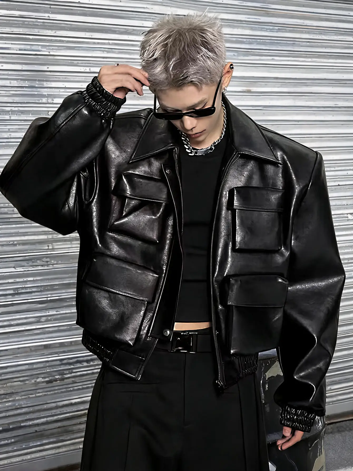 American retro, highly crafted PU leather biker jacket with multiple pockets; loose drop-shoulder short length with a turn-down collar; dark punk high-street style; multi-layered large patch pockets; functional leather outerwear with a soft, fine faux lea