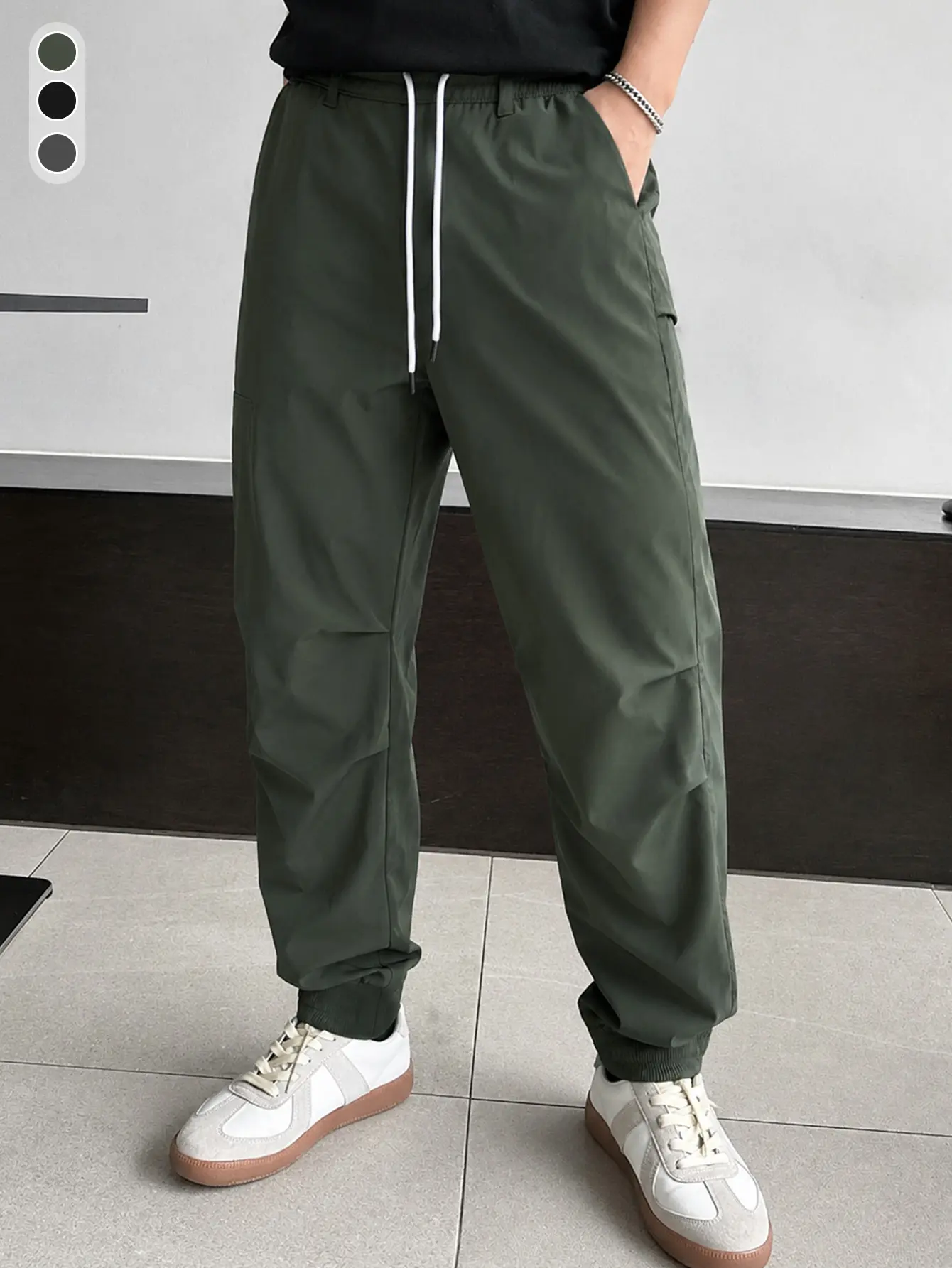 Men’s army green quick-dry jogger pants with elastic waistband and drawstring, breathable casual long pants, Japanese street style, suitable for all seasons, ideal for commuting.