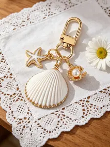 1pc Asymmetrical Shell, Starfish, And Conch Wallet Pendant Decorative Keychain, Nautical Keychain, Ocean Element Conch And Starfish Keyring, Bag Charm For Girls, Vacation Style Accent Piece, Versatile Commuter Decoration, Oceanic Elements, Nautical Theme