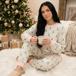 Ultimate cozy Christmas vibes matching family pajama set for women—long-sleeve cotton loungewear with a soft festive green floral print, perfect for Christmas morning photos and as nightwear; also suitable as an external call handset.
