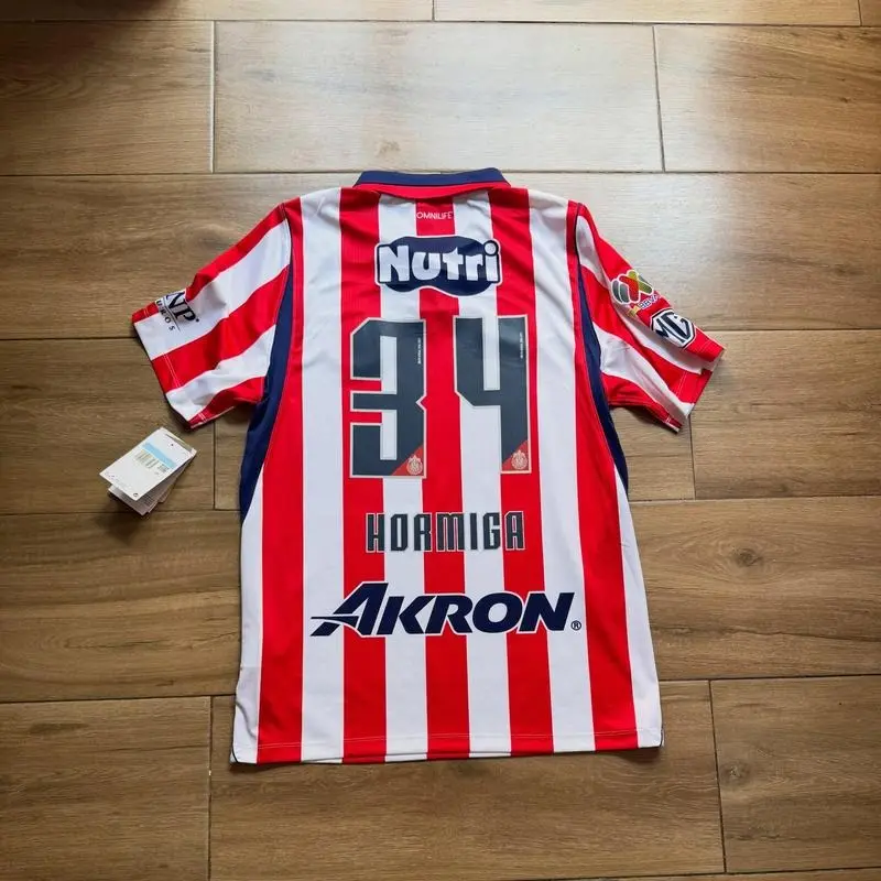 Alvarado, Hormiga, Sandoval Chivas de Guadalajara 2026-27 home jersey with full logo, men's football shirt.