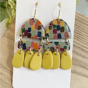 Hand painted clay earrings with mustard clay dangles