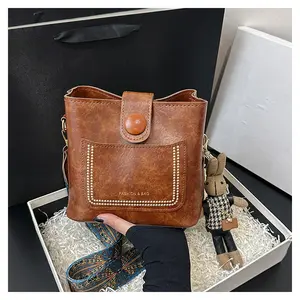 Small Crossbody Bag for Women Trendy Vegan Leather Shoulder Bucket Bag Hobo Handbags with Adjustable Guitar Straps  bunny pendant