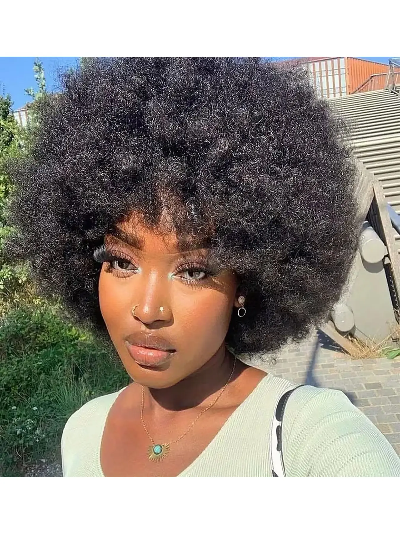 Retro-style voluminous curly wig for women, with bangs, incredibly elastic and full, made of real human hair, suitable for cosplay, everyday wear, and parties, 16 inches.