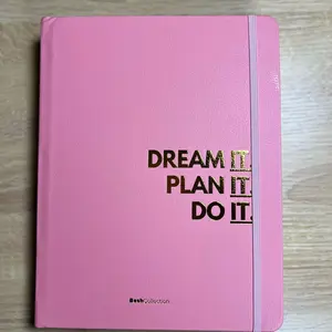Daily Planner - Daily Journal with Envelopes, Pen Holder, and Larger Backing for Effective Use. Elegant Black cover with gold writing. Also available in pink.