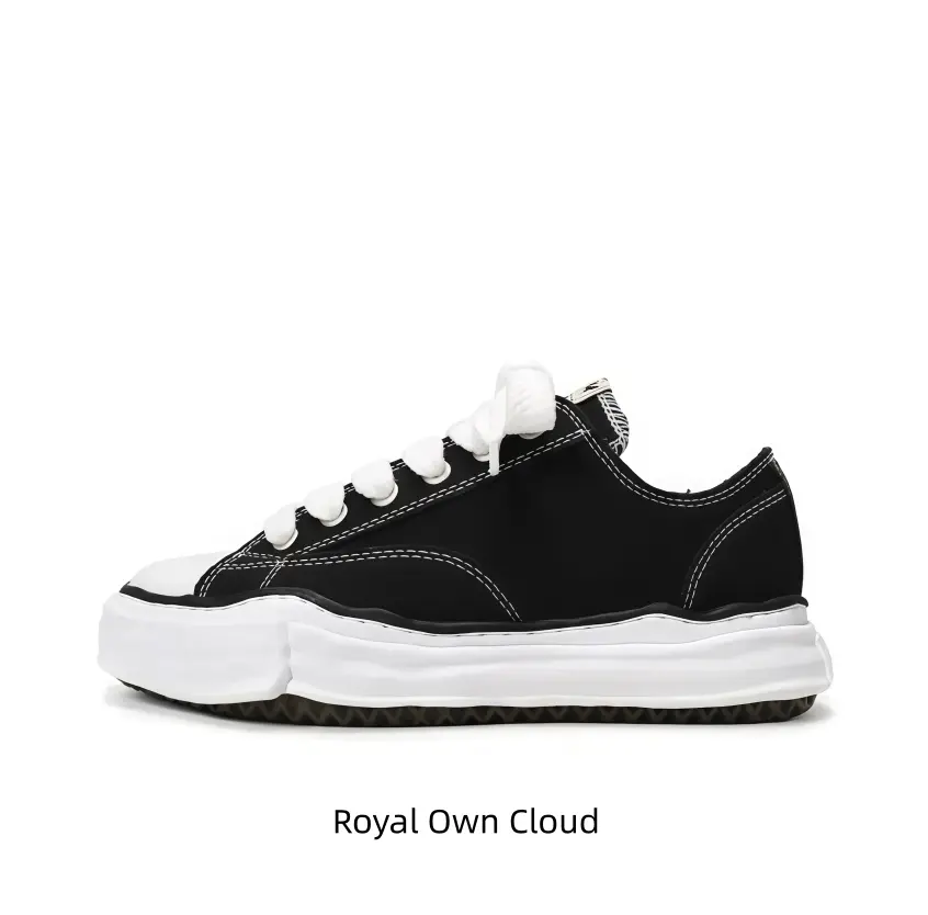 Stitch detailed black canvas low-top shoes with broad thick white laces complement casual shorts ideally, lightweight uneven white sole builds cool youthful relaxed street aesthetic.