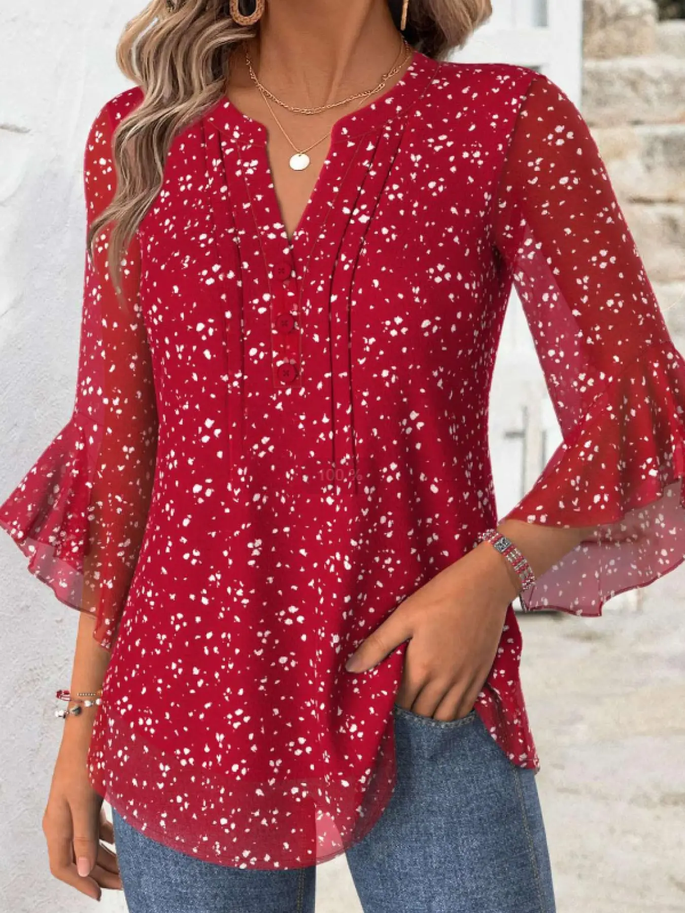 A ladies' red V-neck Chic buttoned lace long-sleeved blouse top with a graceful, elegant and fitted style, suitable for the festive atmosphere of Christmas.